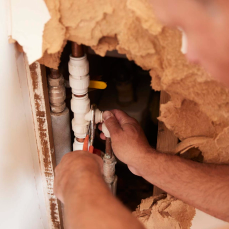 plumber repairing water pipes